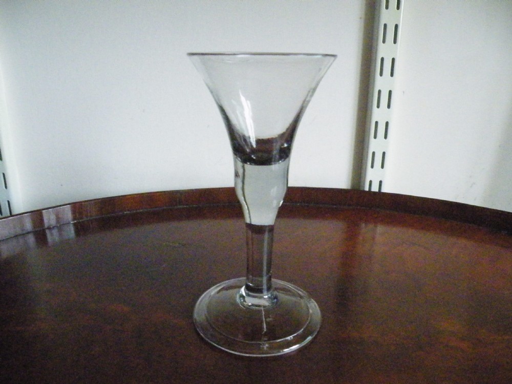 a mid 18th century plain stem wine glass