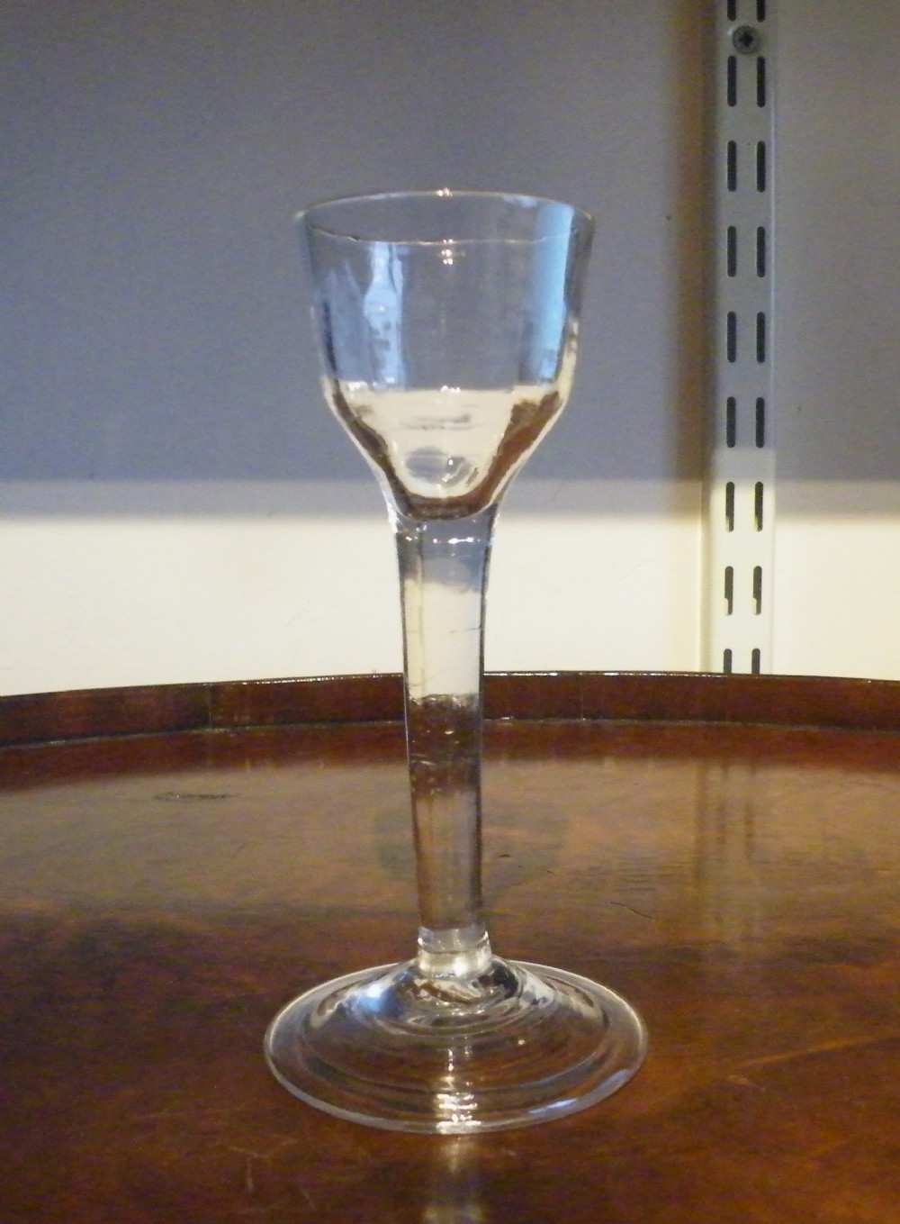 an 18th century plain stem cordial glass