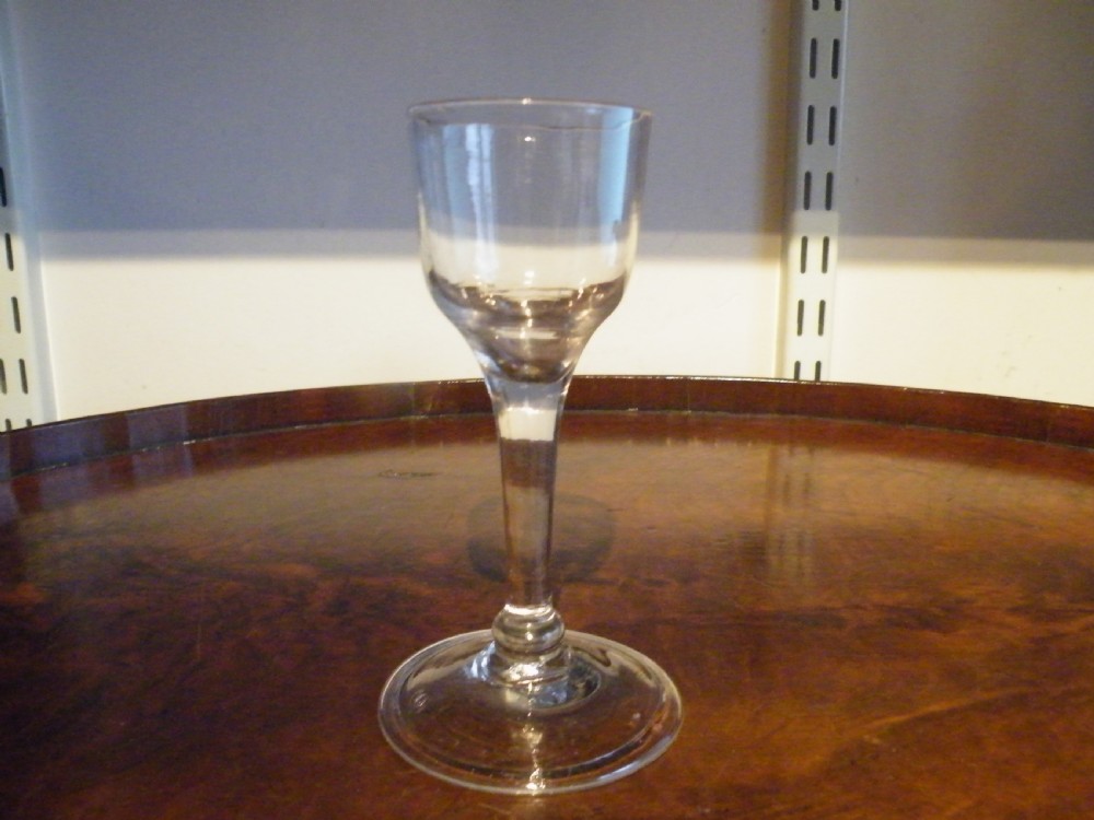 an 18th century knopped plain stem wine glass