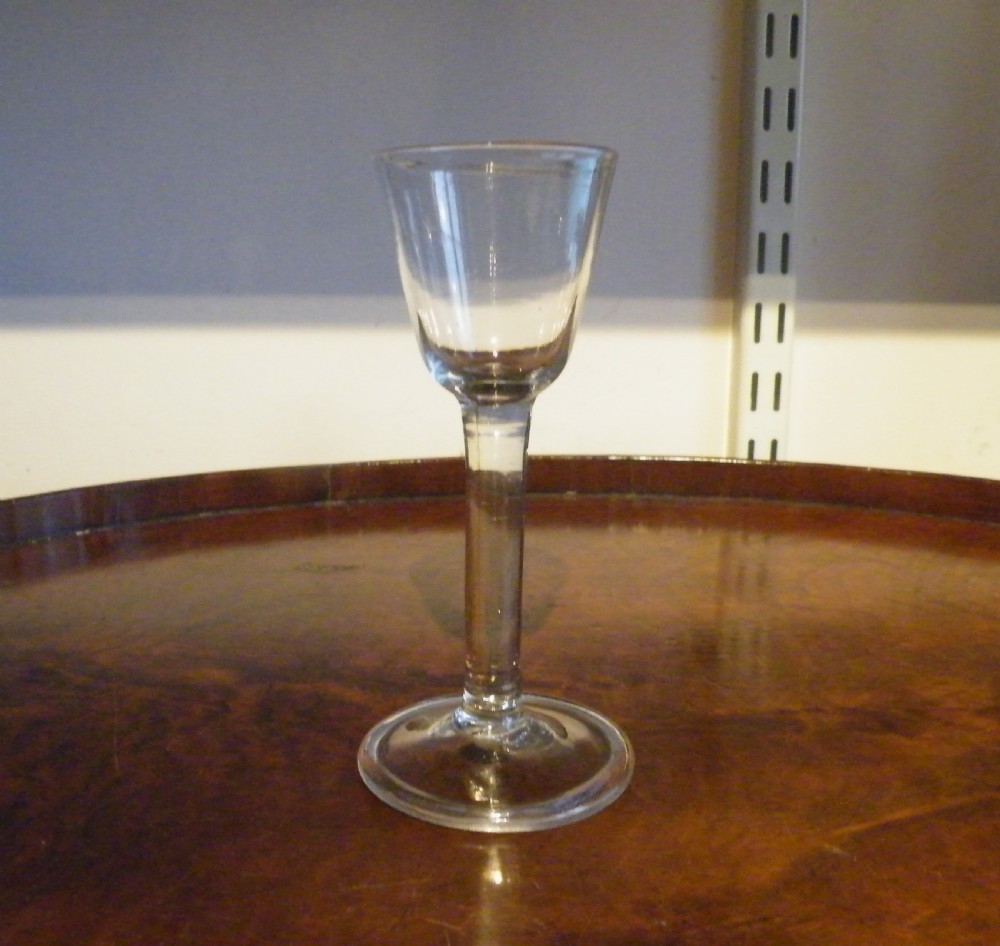 an 18th century plain stem wine glass