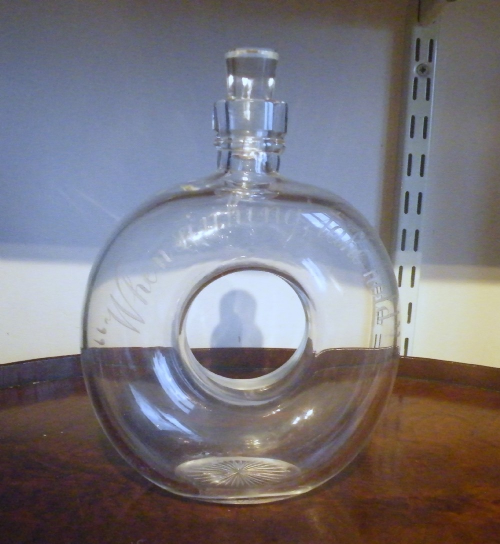 a very rare 19th century life belt shape decanter engraved when sinking take hold