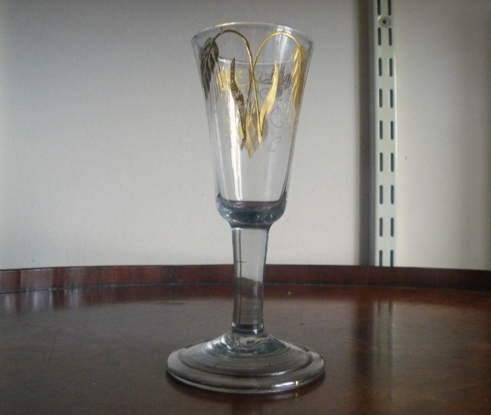 an 18th century short ale glass with engraved and gilded bowl circa 1740