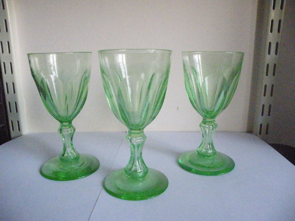 three 19th century vaseline green glass wine glasses