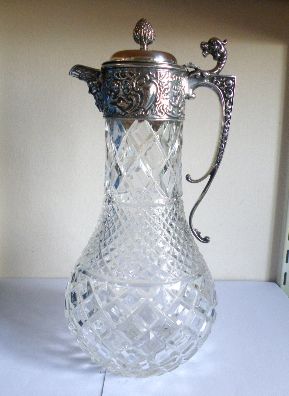 a suprior quality george v silver and glass claret jug