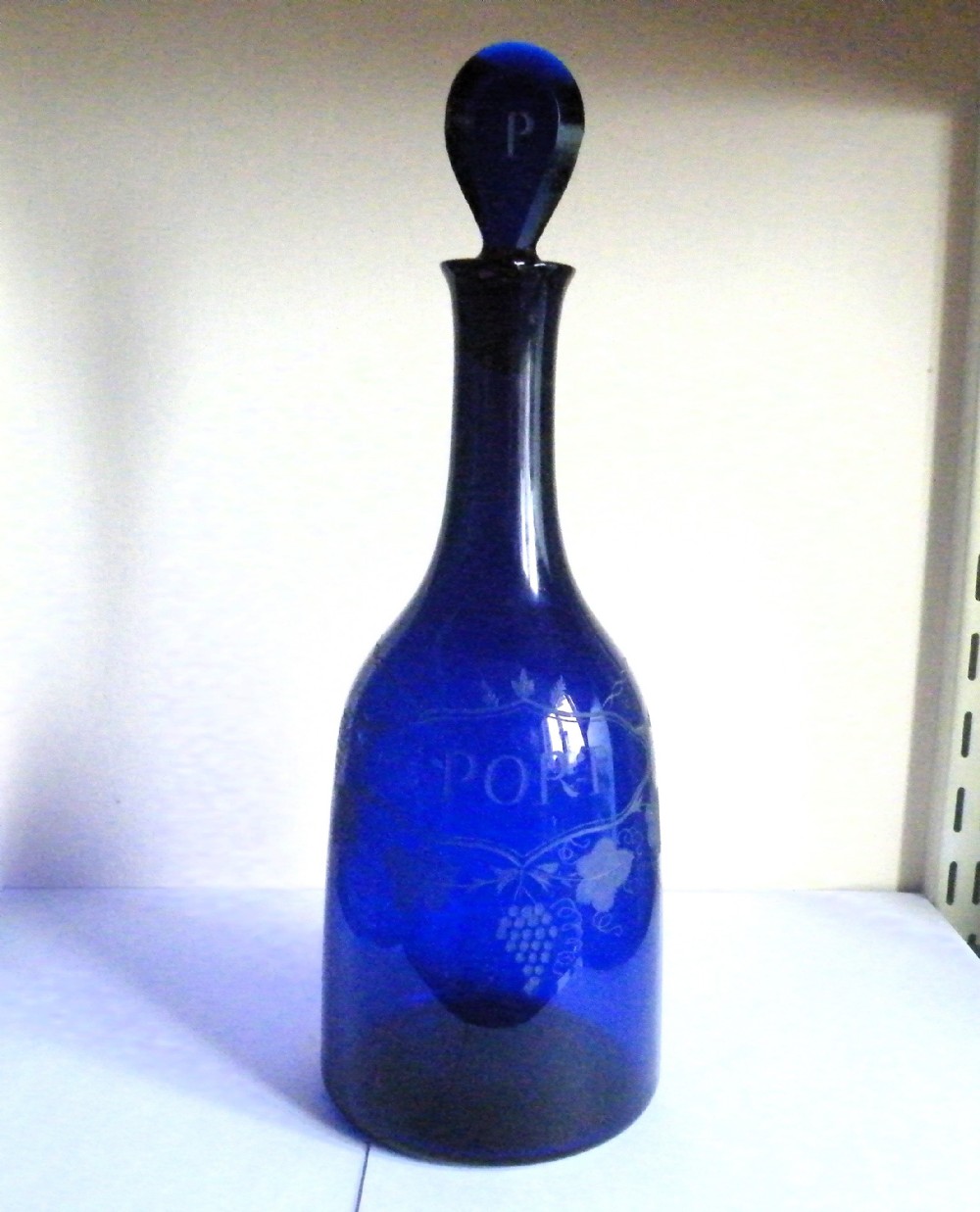 a very rare 18th century bristol blue glass labelled port decanter